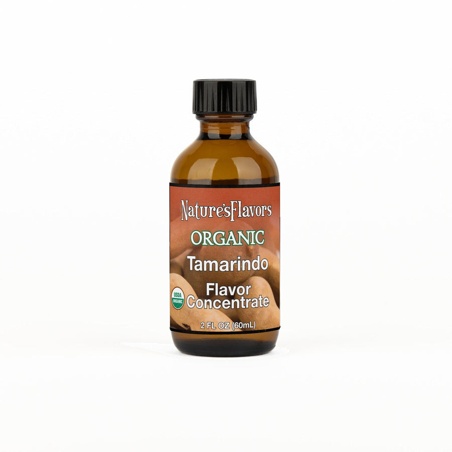 A 2 fl oz amber glass bottle of Nature's Flavors Organic Tamarindo Flavor Concentrate Without Diacetyl with a black cap, centered on a white background.