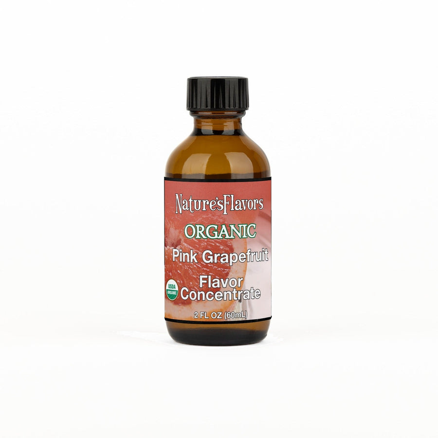 A 2 fl oz amber glass bottle of Nature's Flavors Organic Pink Grapefruit Flavor Concentrate Without Diacetyl with a black cap, centered on a white background.