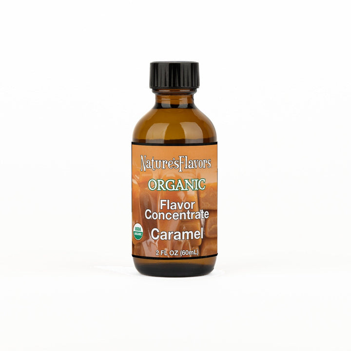 A 2 fl oz amber glass bottle of Nature's Flavors Organic Flavor Concentrate, Caramel with a black cap, centered on a white background.