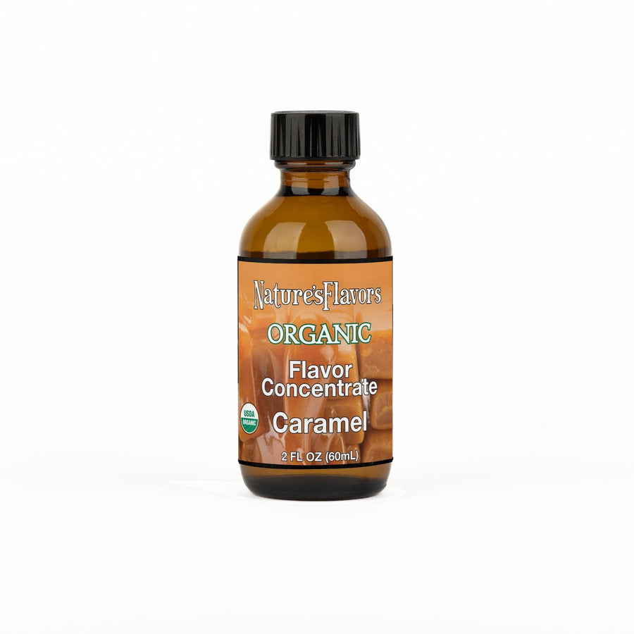 A 2 fl oz amber glass bottle of Nature's Flavors Organic Flavor Concentrate, Caramel with a black cap, centered on a white background.