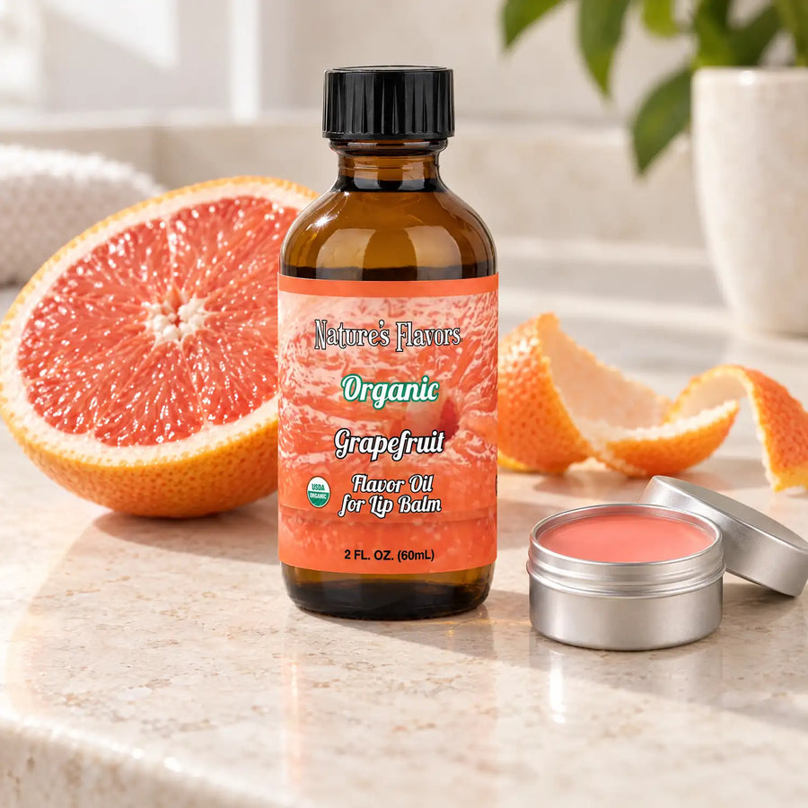 Nature's Flavors Organic Grapefruit Flavor Oil for Lip Balm, 2 oz bottle with flavor cues and an open lip-balm tin.