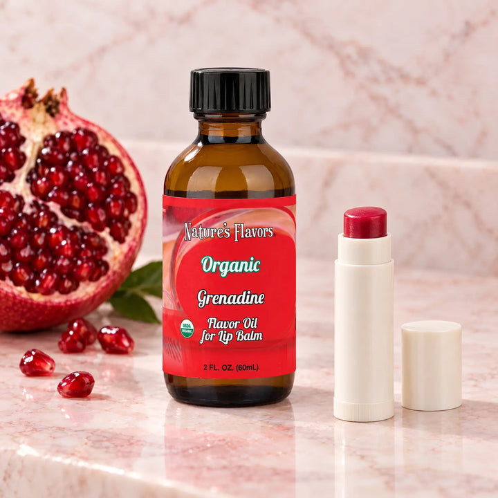 Nature's Flavors Organic Grenadine Flavor Oil for Lip Balm, 2 oz bottle with flavor cues and an open lip-balm tube.