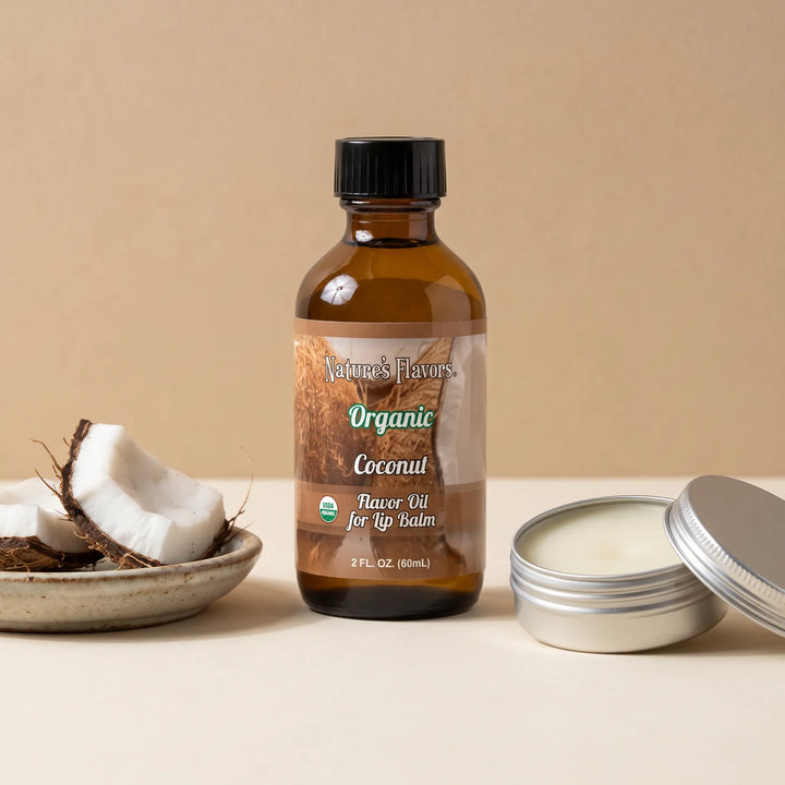 Nature's Flavors Organic Coconut Flavor Oil for Lip Balm, 2 oz bottle with coconut and an open unbranded lip balm tin.