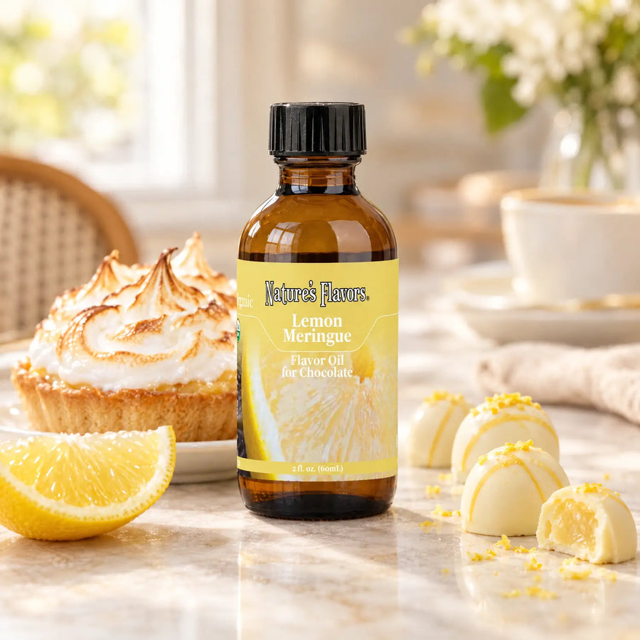 Nature's Flavors Organic Lemon Meringue Flavor Oil For Chocolate, 2-ounce bottle, with lemon meringue tart and white chocolate bonbons.