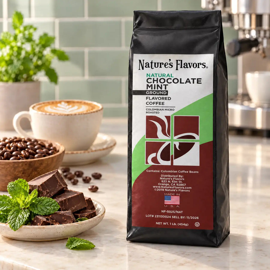 Nature’s Flavors Chocolate Mint Flavored Coffee Beans, 1 lb. Ground, in a black labeled bag beside chocolate and mint, whole roasted coffee beans and a filled coffee drink in a bright coffee scene.