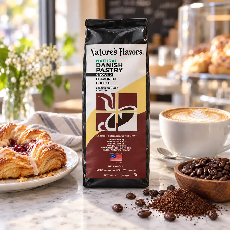 Nature’s Flavors Danish Pastry Flavored Coffee Beans, 1 lb. Ground, beside flavor cues, roasted coffee beans, grounds and a filled coffee drink in a bright lifestyle scene.