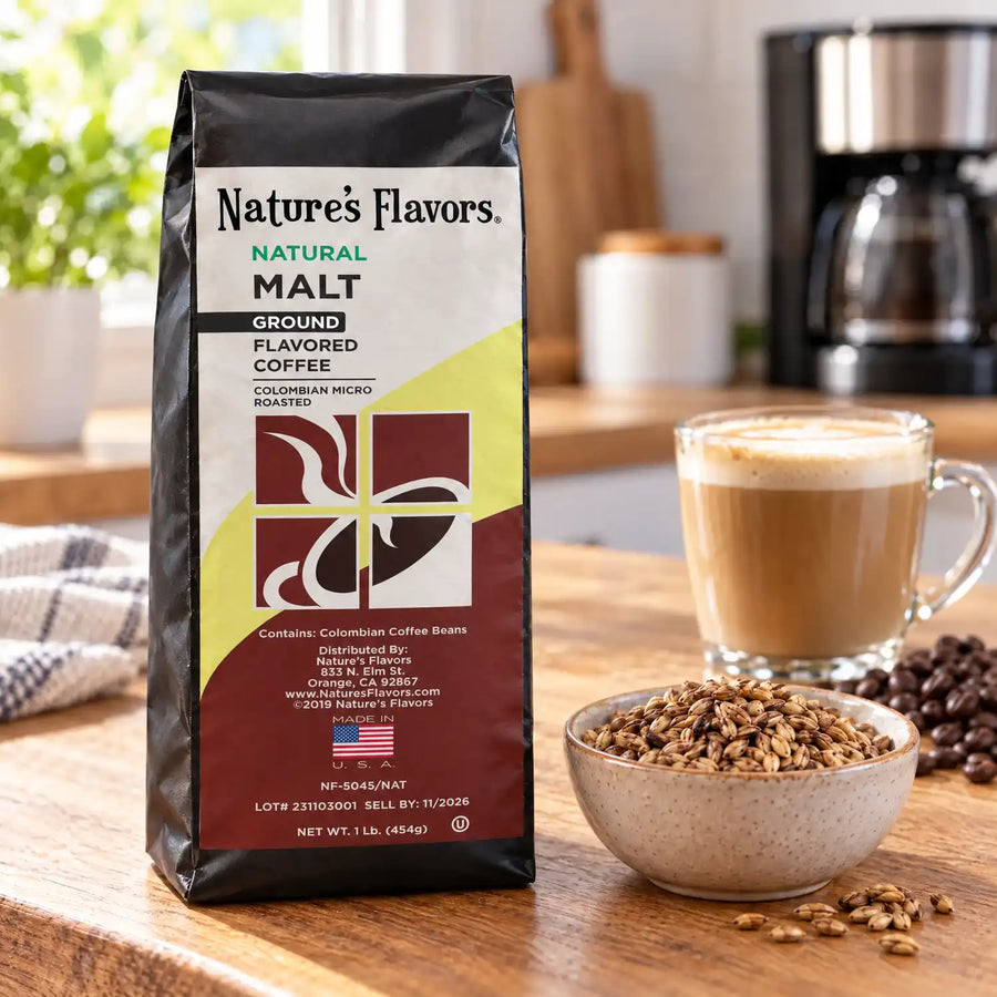Nature’s Flavors Malt Flavored Coffee Beans, 1 lb. Ground, in a black labeled bag beside malted barley, whole roasted coffee beans and a filled coffee drink in a bright coffee scene.