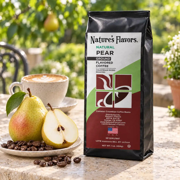 Nature’s Flavors Pear Flavored Coffee Beans, 1 lb. Ground, in a black labeled bag beside pear, whole roasted coffee beans and a filled coffee drink in a bright coffee scene.