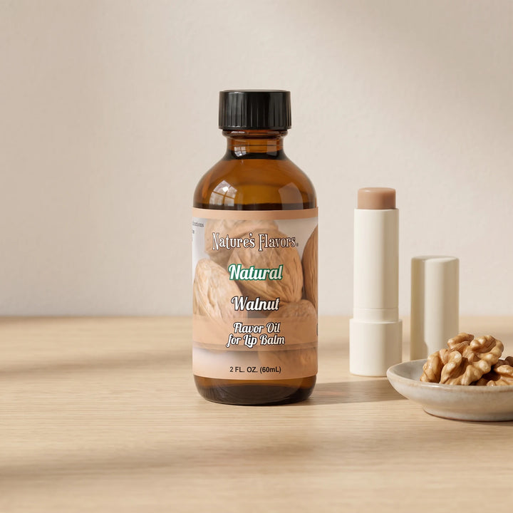 Nature's Flavors Walnut Flavor Oil for Lip Balm, 2 oz bottle with walnuts and an open unbranded lip balm tube.