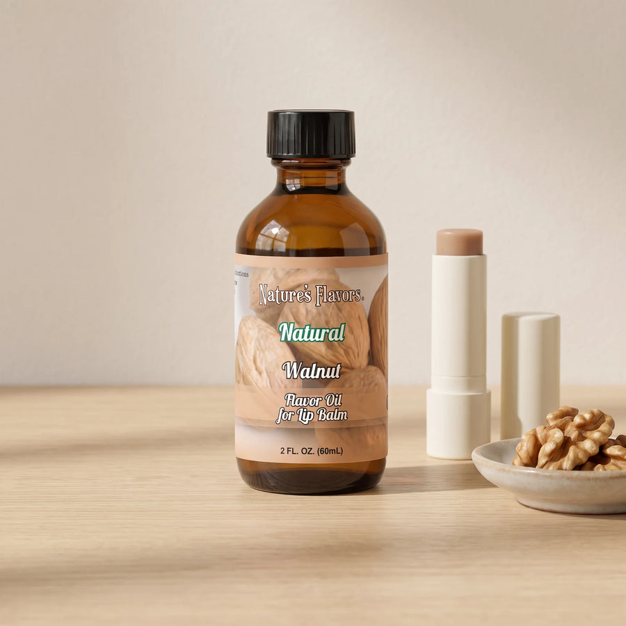 Nature's Flavors Walnut Flavor Oil for Lip Balm, 2 oz bottle with walnuts and an open unbranded lip balm tube.