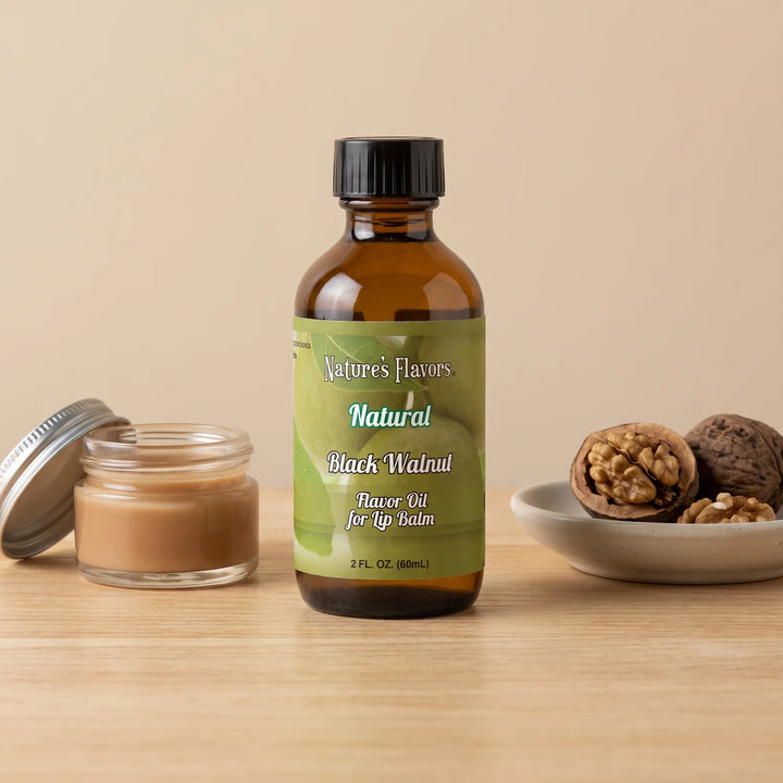 Nature's Flavors Black Walnut Flavor Oil for Lip Balm, 2 oz bottle with walnuts and an open unbranded lip balm jar.