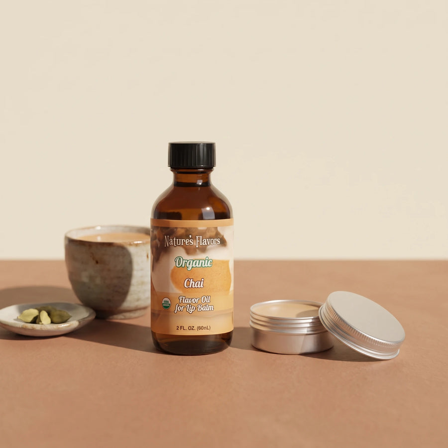 Nature's Flavors Organic Chai Flavor Oil for Lip Balm, 2 oz bottle with chai and an open unbranded lip balm tin.