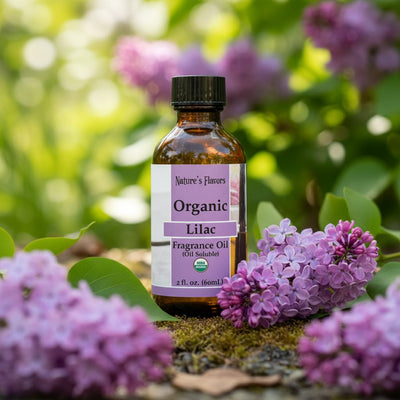 Bottle of Organic Lilac Fragrance Oil with lilac flowers in the background