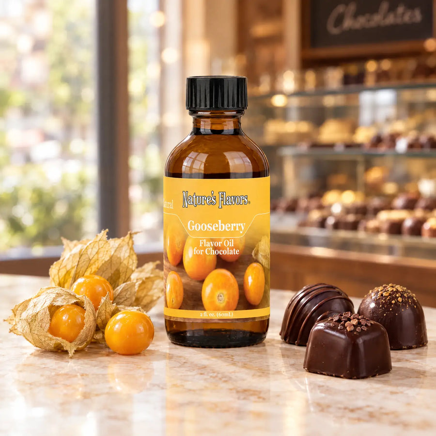 Nature's Flavors Gooseberry Flavor Oil for Chocolate, 2-ounce bottle, with golden gooseberries and chocolate bonbons.