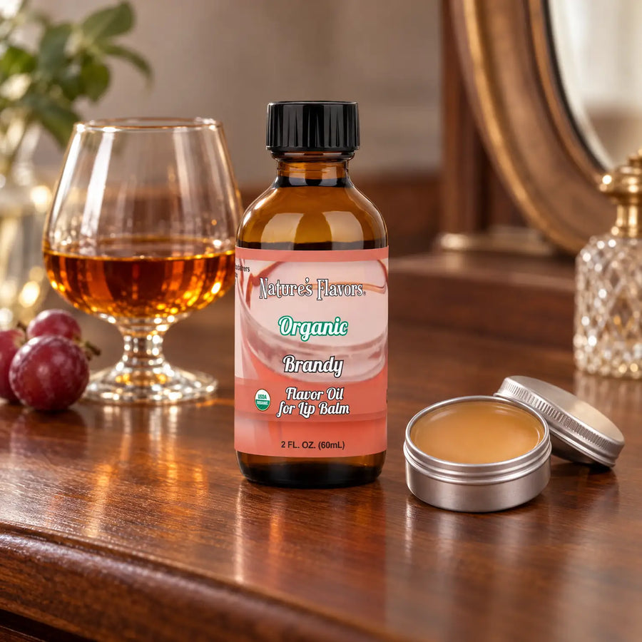 Nature's Flavors Organic Brandy Flavor Oil for Lip Balm, 2 oz bottle with flavor cues and an open lip-balm tin.
