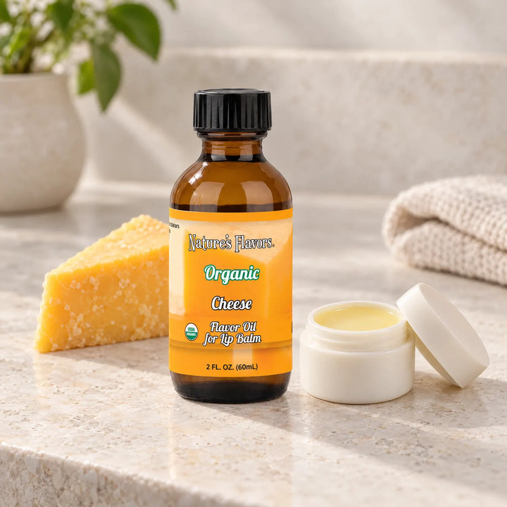 Nature's Flavors Organic Cheese Flavor Oil for Lip Balm, 2 oz bottle with flavor cues and an open lip-balm jar.