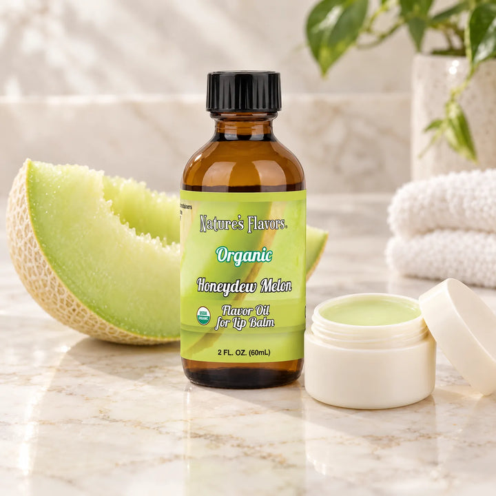 Nature's Flavors Organic Honeydew Melon Flavor Oil for Lip Balm, 2 oz bottle with flavor cues and an open lip-balm jar.