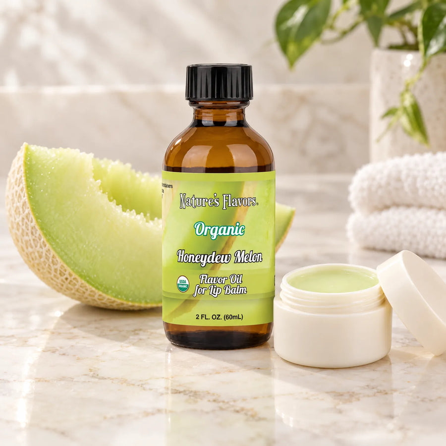 Nature's Flavors Organic Honeydew Melon Flavor Oil for Lip Balm, 2 oz bottle with flavor cues and an open lip-balm jar.