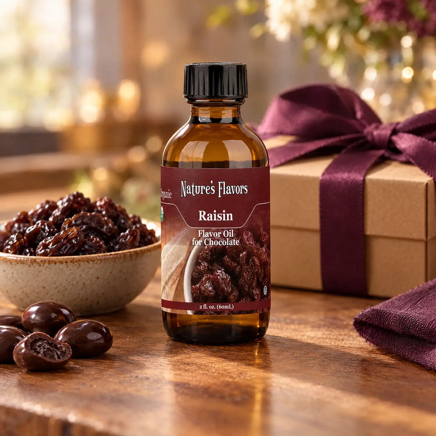 Nature's Flavors Organic Raisin Flavor Oil For Chocolate, 2-ounce bottle, with raisins and chocolate-covered raisins.