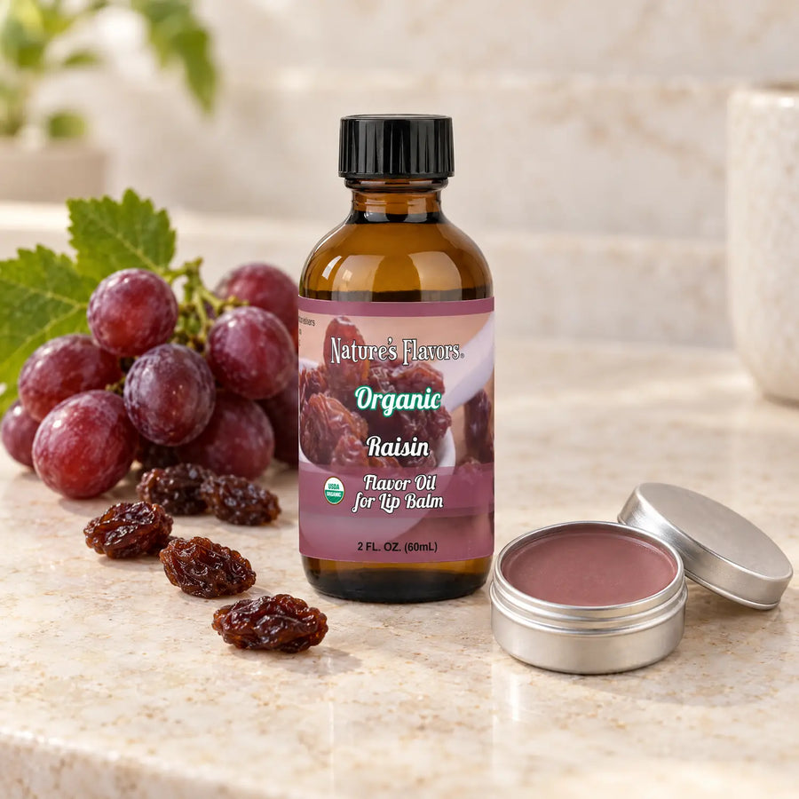 Nature's Flavors Organic Raisin Flavor Oil for Lip Balm, 2 oz bottle with flavor cues and an open lip-balm tin.