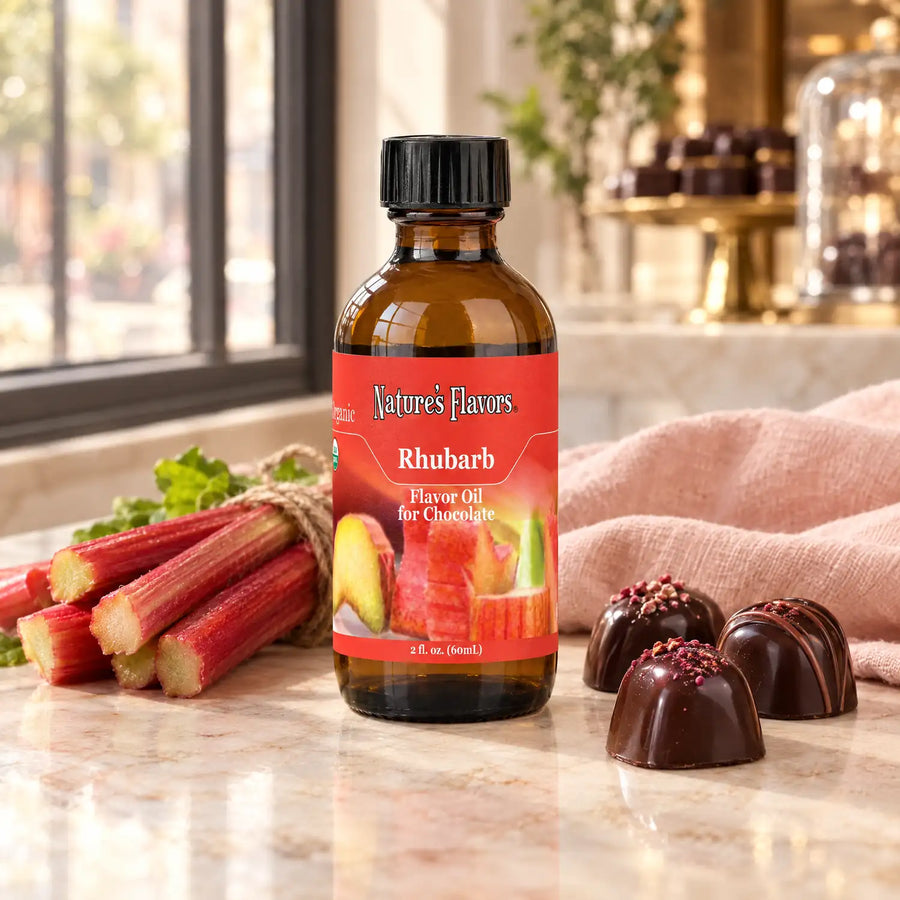 Nature's Flavors Organic Rhubarb Flavor Oil For Chocolate, 2-ounce bottle, with rhubarb stalks and dark chocolate bonbons.