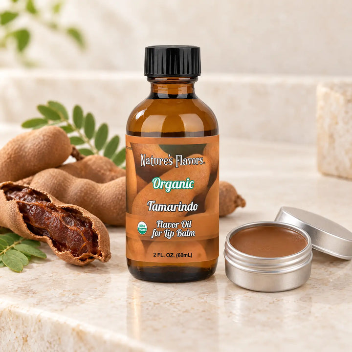 Nature's Flavors Organic Tamarindo Flavor Oil for Lip Balm, 2 oz bottle with flavor cues and an open lip-balm tin.