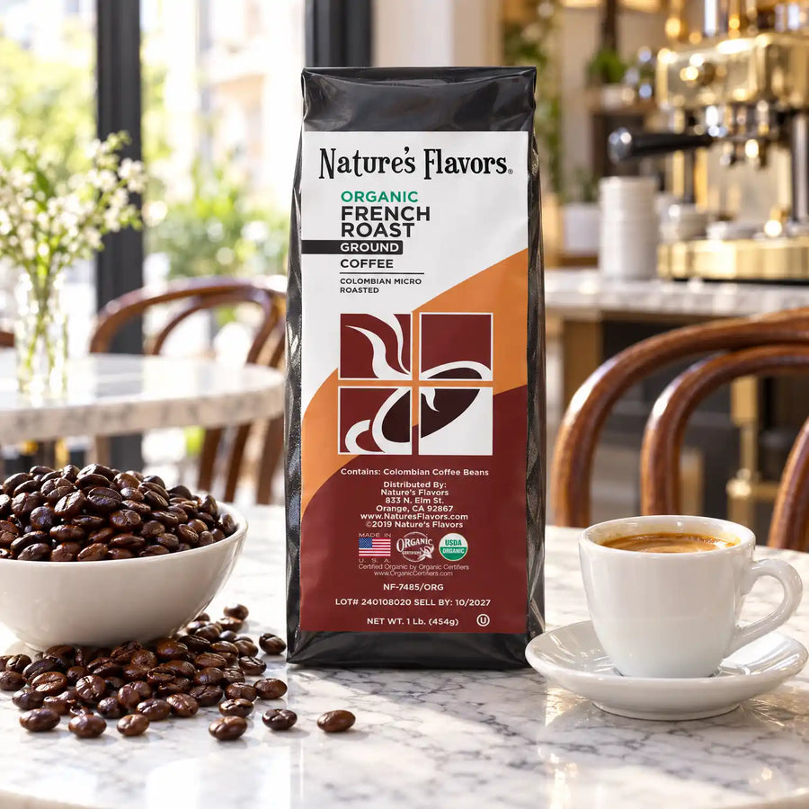Nature’s Flavors Organic French Roast Coffee Beans, 1 lb. Ground, in a black labeled bag with whole roasted coffee beans and a filled coffee drink in a bright french coffee shop.