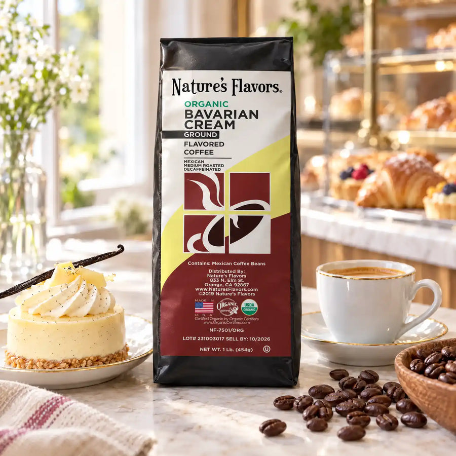 Nature’s Flavors Organic Decaf Bavarian Cream Flavored Coffee Beans, 1 lb. Ground, in a black labeled bag with whole roasted coffee beans and a filled coffee drink in a bright european bakery coffee shop.