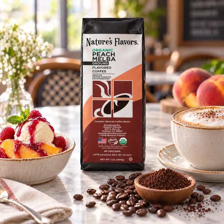 Nature’s Flavors Organic Decaf Peach Melba Flavored Coffee Beans, 1 lb. Ground, beside flavor cues, roasted coffee beans, grounds and a filled coffee drink in a bright lifestyle scene.