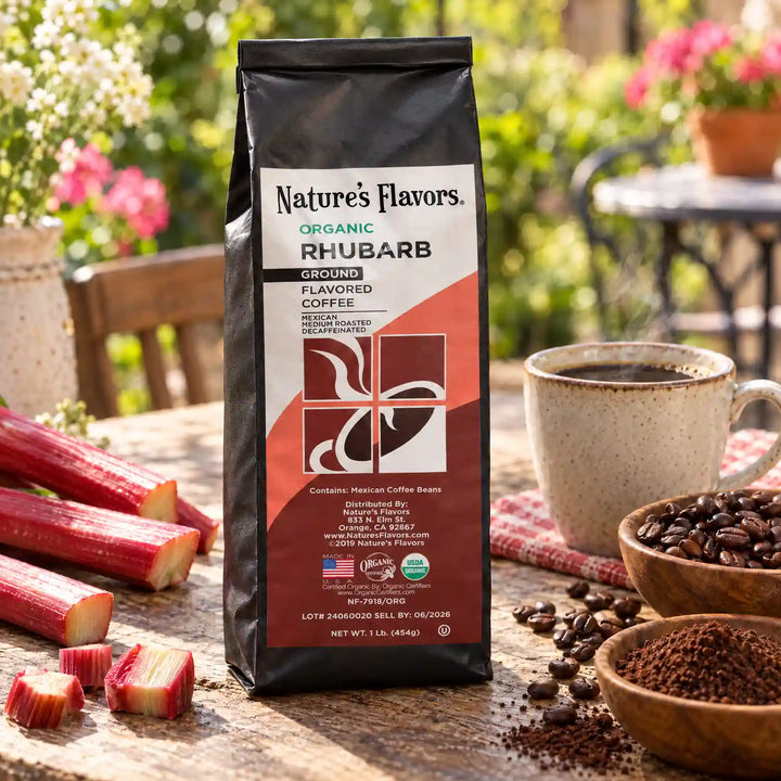 Nature’s Flavors Organic Decaf Rhubarb Flavored Coffee Beans, 1 lb. Ground, beside flavor cues, roasted coffee beans, grounds and a filled coffee drink in a bright lifestyle scene.