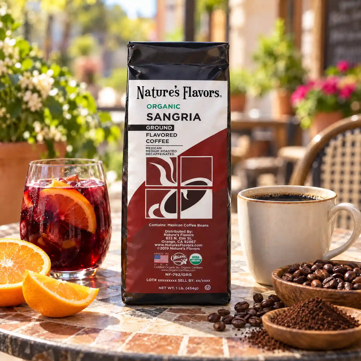 Nature’s Flavors Organic Decaf Sangria Flavored Coffee Beans, 1 lb. Ground, beside flavor cues, roasted coffee beans, grounds and a filled coffee drink in a bright lifestyle scene.