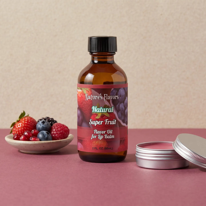 Nature's Flavors Super Fruit Flavor Oil for Lip Balm, 2 oz bottle with mixed fruit flavor cues and an open unbranded lip balm tin.