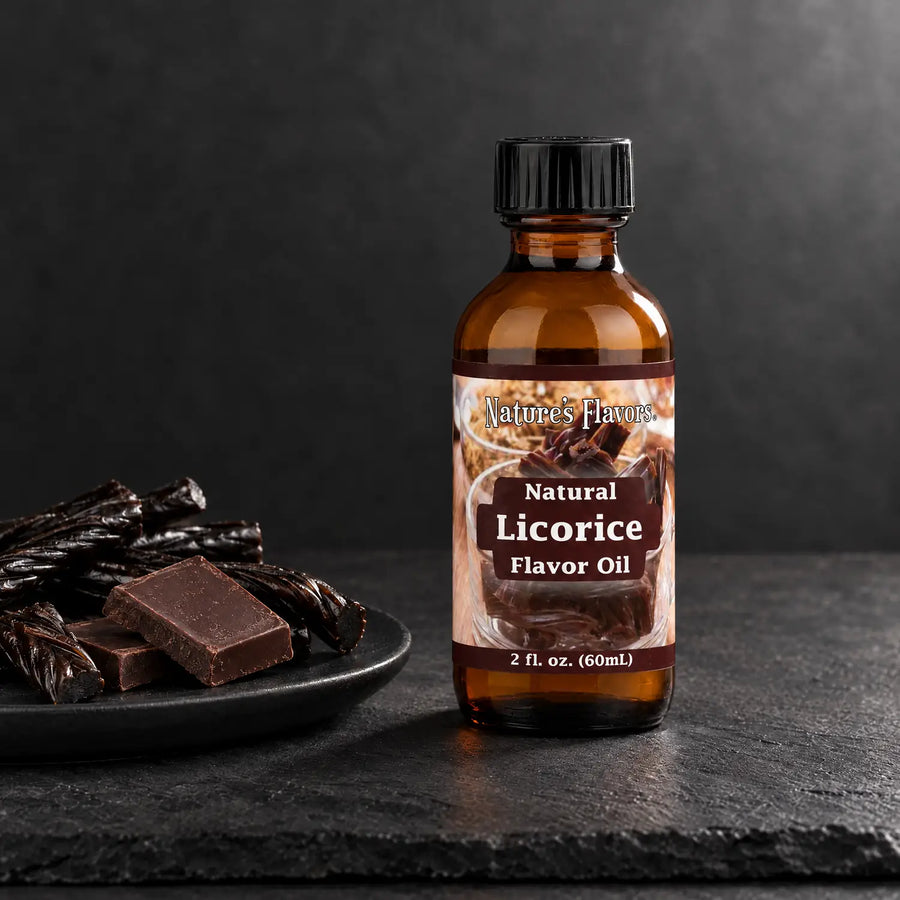 Nature's Flavors Licorice Flavor Oil, Natural, 2-ounce bottle, with licorice twists and dark chocolate pieces on slate.