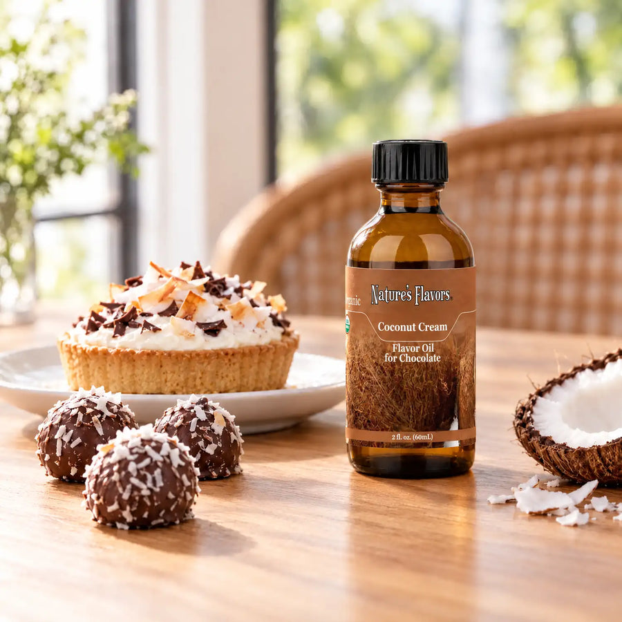Nature's Flavors Organic Coconut Cream Flavor Oil For Chocolate, 2-ounce bottle, with coconut cream tart and coconut chocolate truffles at a patisserie.