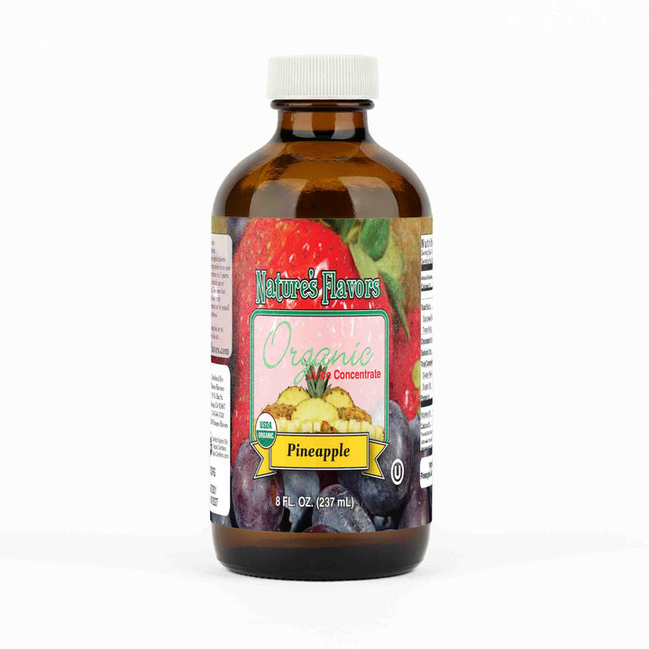 A small brown bottle with a label that reads, "Organic Juice Concentrate, Pineapple. 8 fl oz."
