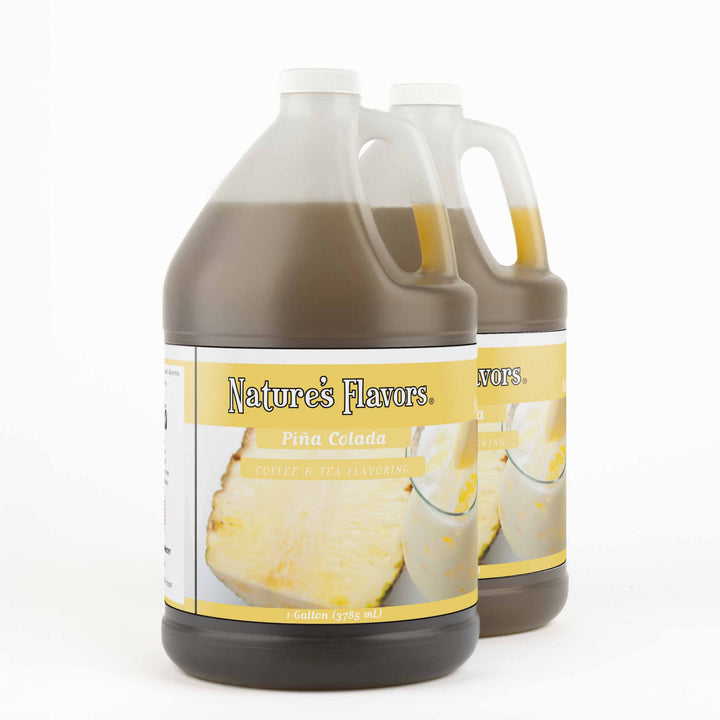 Two, 1 gallon bottles both with a label that read, "Piña Colada Coffee & Tea Flavoring"