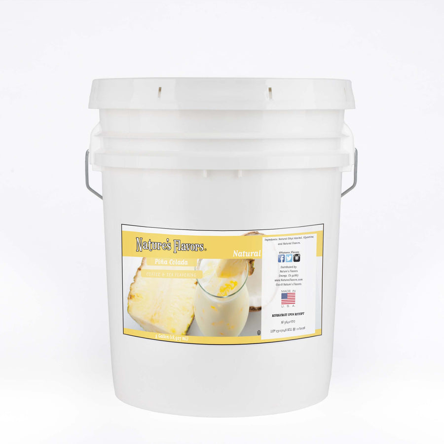 A white bucket with a label on it that reads "Natural Piña Colada Coffee and Tea Flavoring. 5 Gallon. 