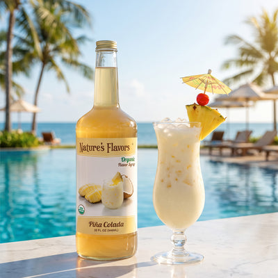 Bottle labeled, "Organic Flavor Syrup Piña Colada" next to a cocktail. 