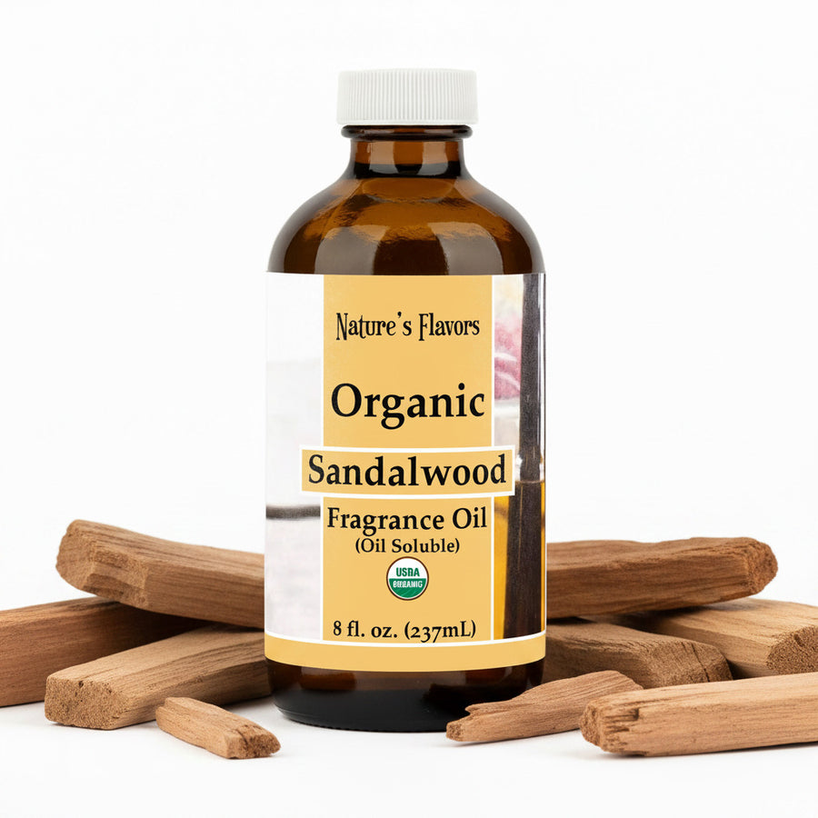 Bottle labeled, "Organic Sandalwood Fragrance Oil (oil soluble)" with bits of sandalwood surrounding it. 