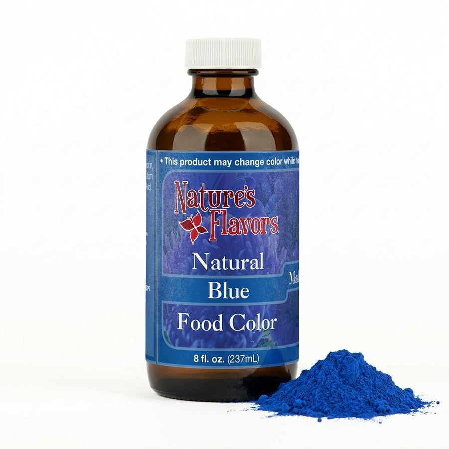 Bottle labeled, "Natural Blue Food Color" next to a small pile of blue spirulina powder. 